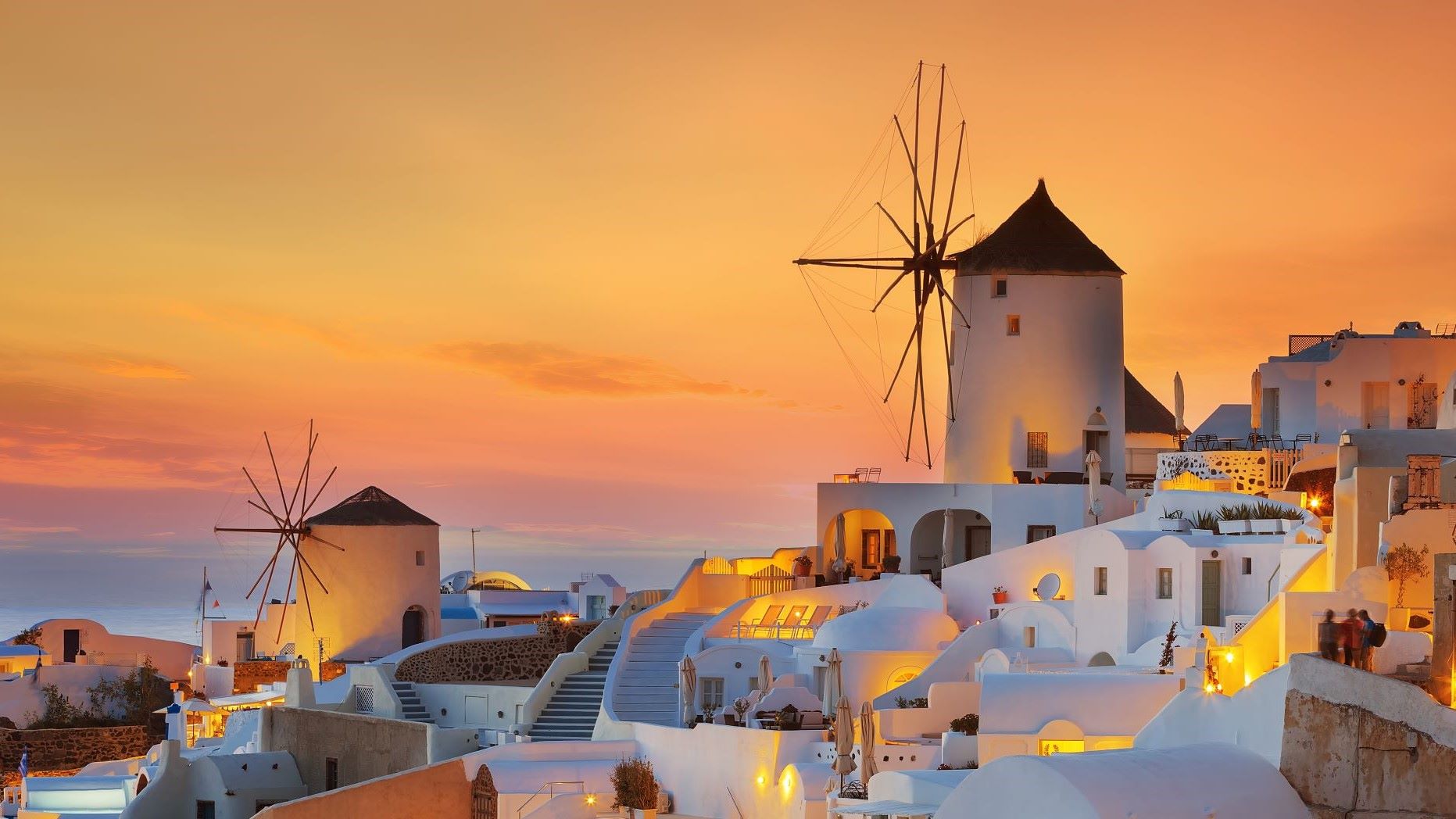 windmills among homes in seaside village