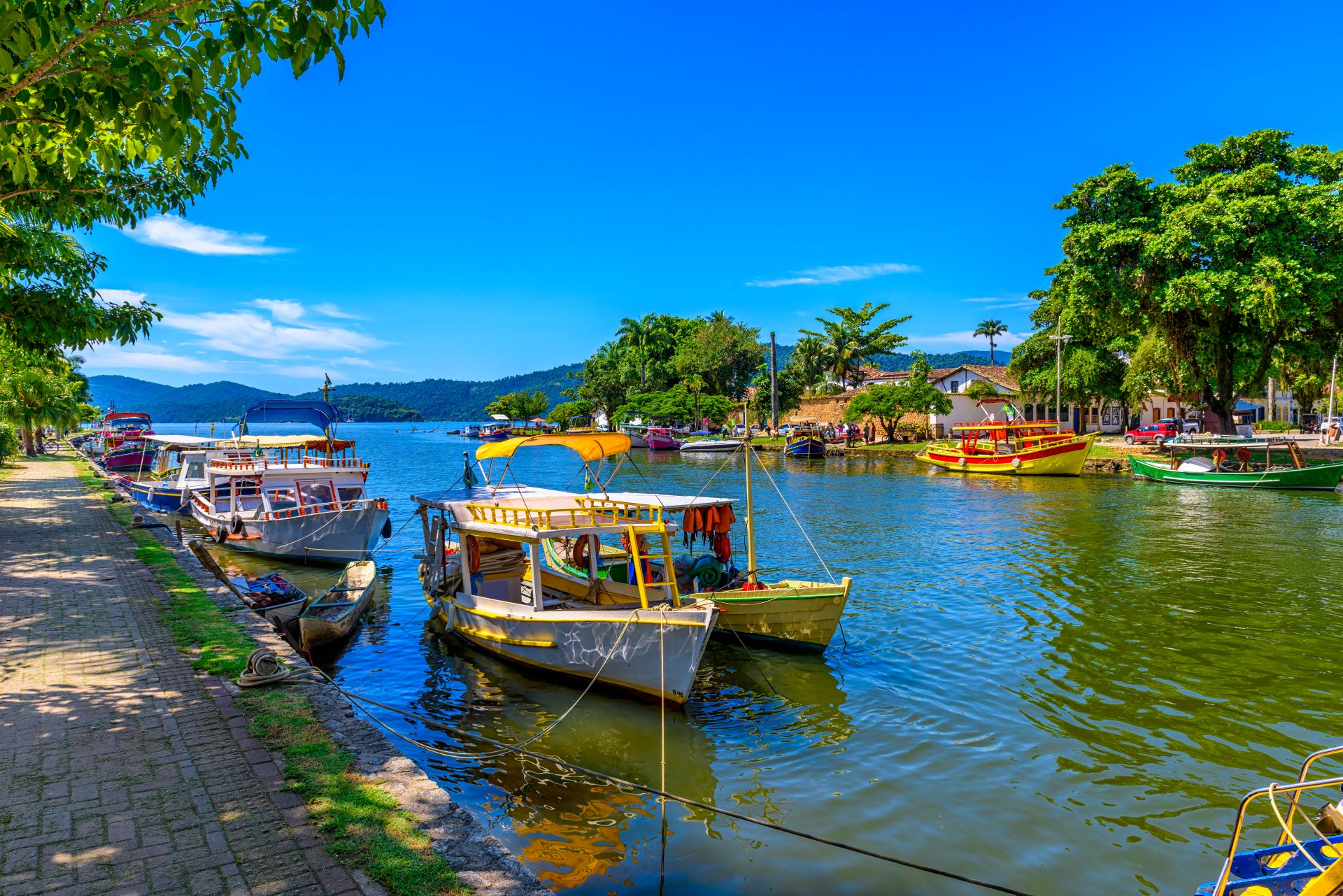 catamaran in waterway of small village