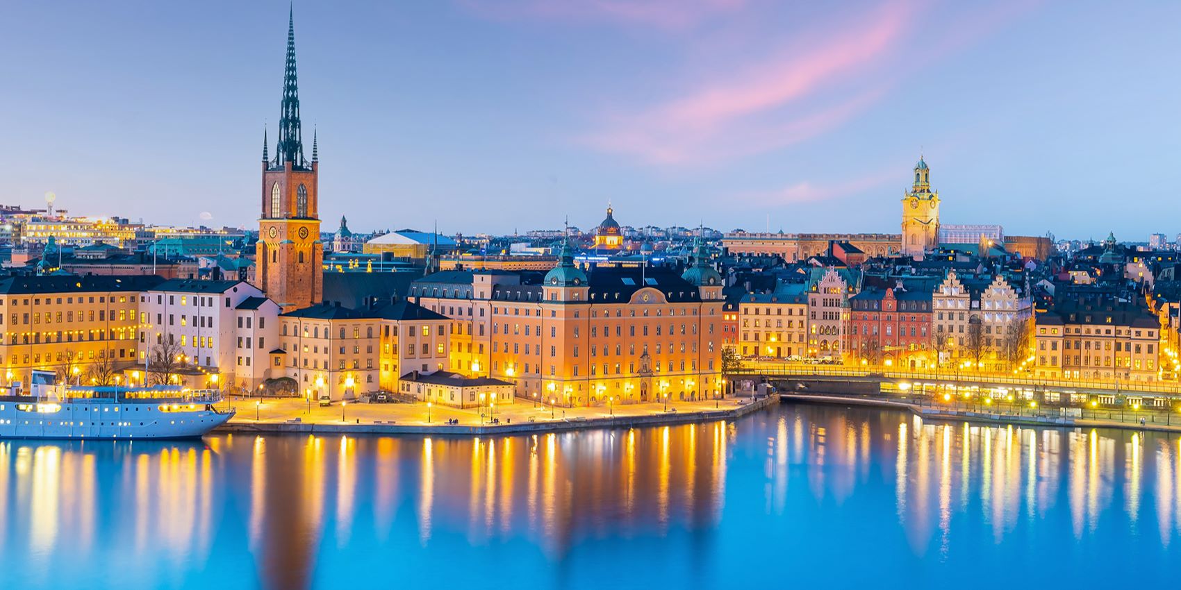 lit cityscape of scotland at dusk