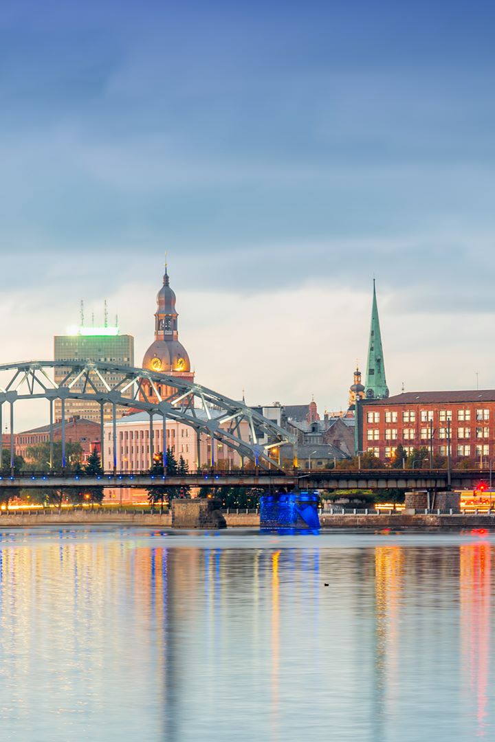 bridge and city skyline at dusk