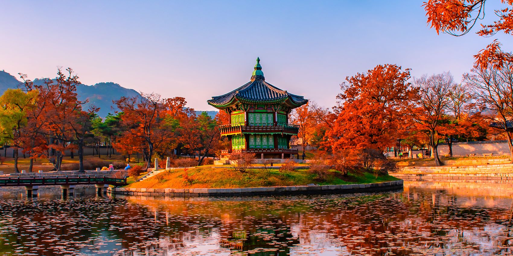 pagoda in late afternoon surrounded by red leaved trees 