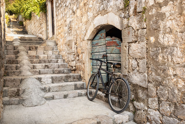 Single bicycle in a steep stepped Dubrovnik alleyway, Croatia