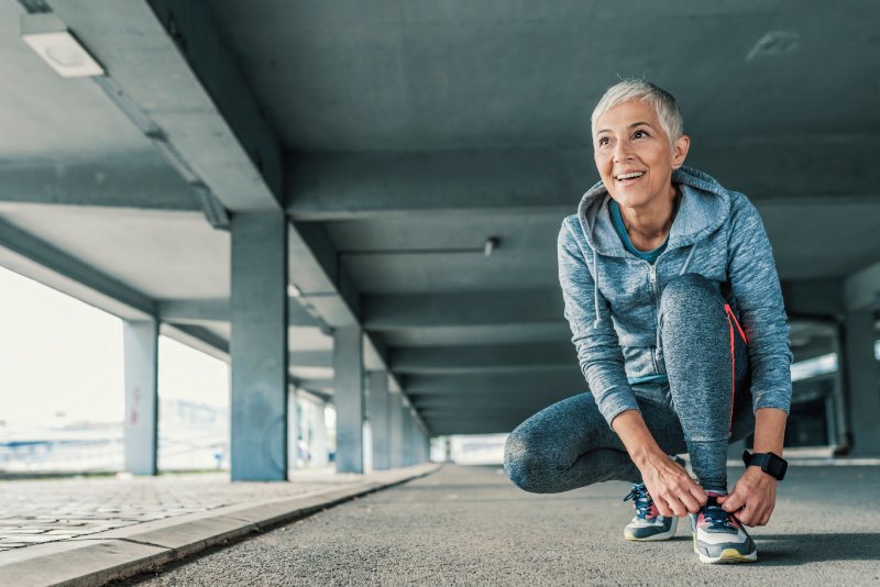 Female sport fitness runner getting ready for jogging outdoor