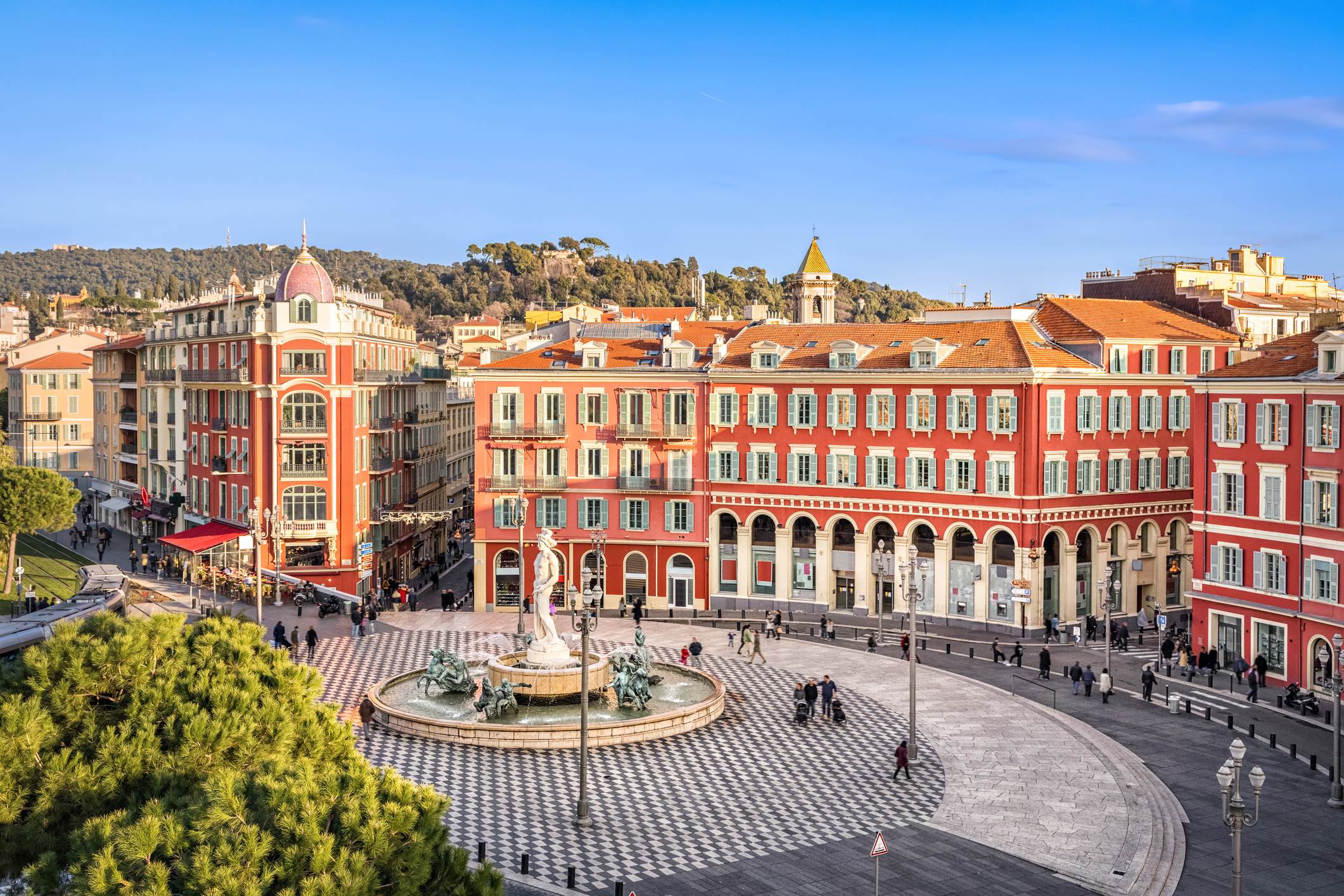 Aerial view of Place Massena square with red buildings and fountain in Nice, France